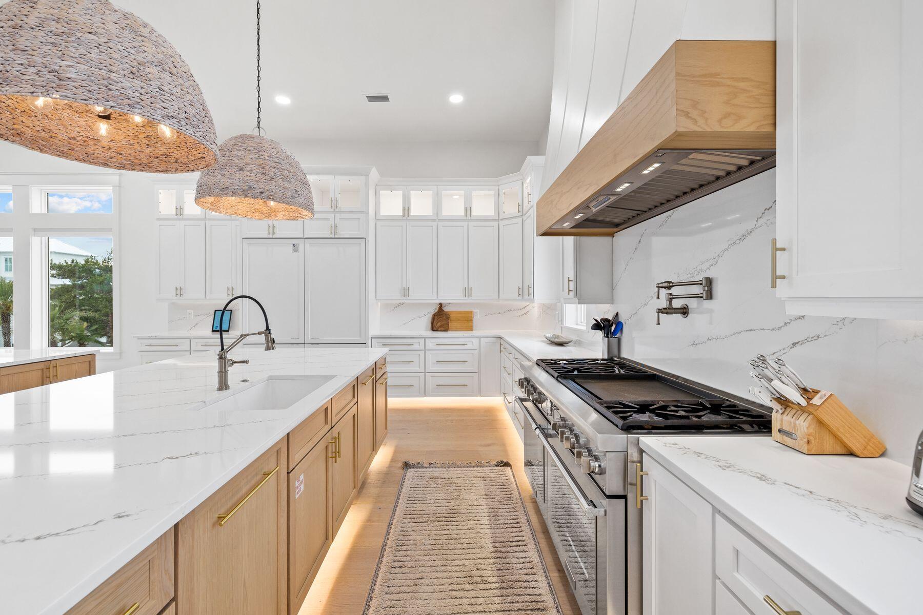 311 Walton Rose Ln Inlet Beach Inlet Beach, FL 32461 - Photo 24 of 93 a kitchen that has a lot of cabinets in it