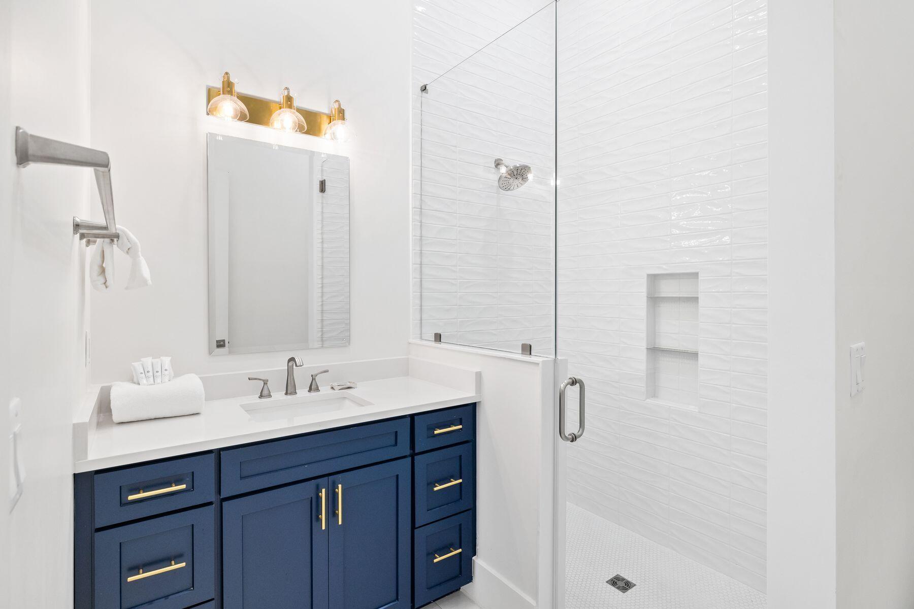 311 Walton Rose Ln Inlet Beach Inlet Beach, FL 32461 - Photo 29 of 93 a bathroom with a shower sink vanity and mirror