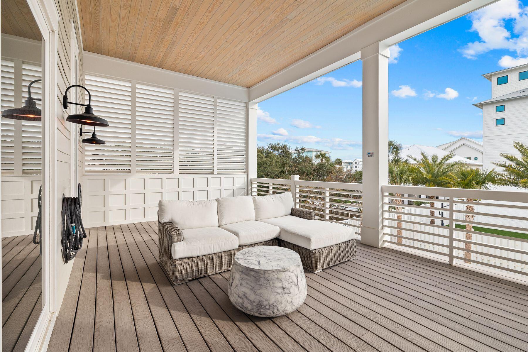 311 Walton Rose Ln Inlet Beach Inlet Beach, FL 32461 - Photo 42 of 93 a balcony with wooden floor and outdoor seating