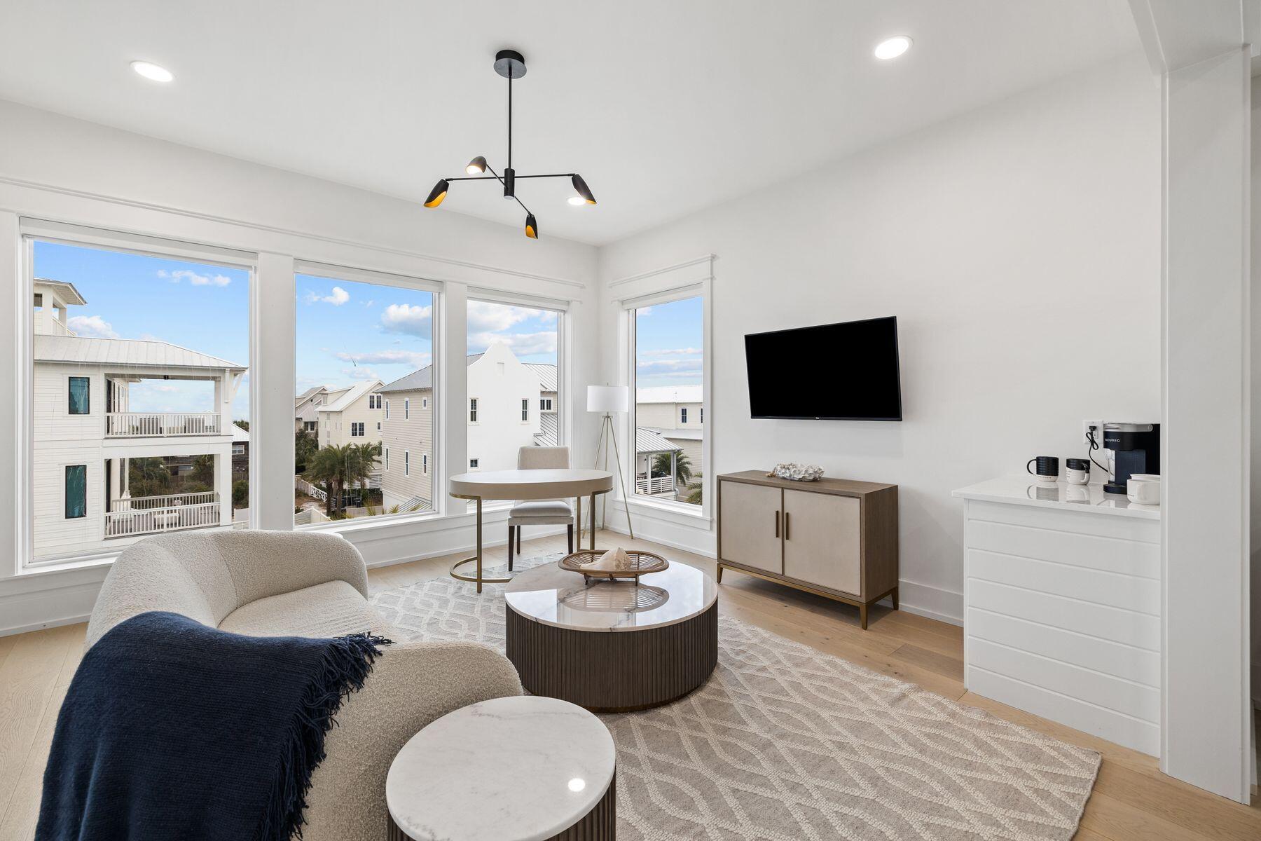 311 Walton Rose Ln Inlet Beach Inlet Beach, FL 32461 - Photo 66 of 93 a living room with furniture a flat screen tv and kitchen view