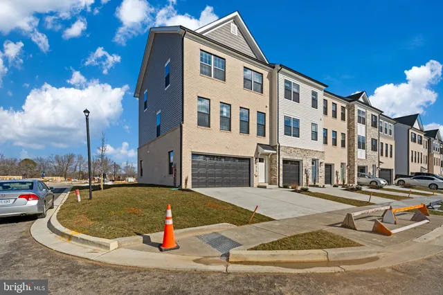 a view of outdoor space with seating area and car parked