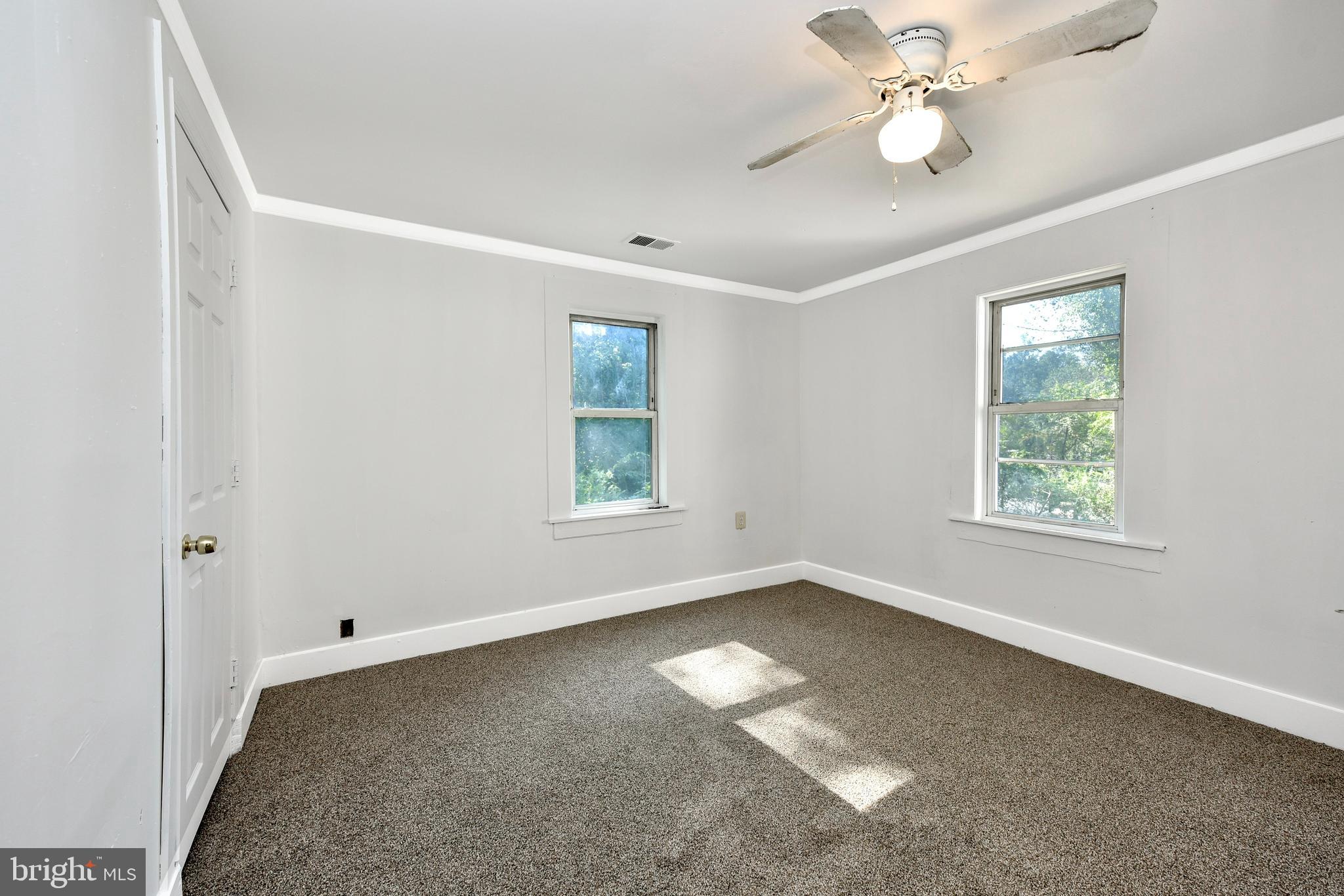 19086 Windsor Road Triangle, VA 22172 - Photo 4 of 9 a view of an empty room with a window