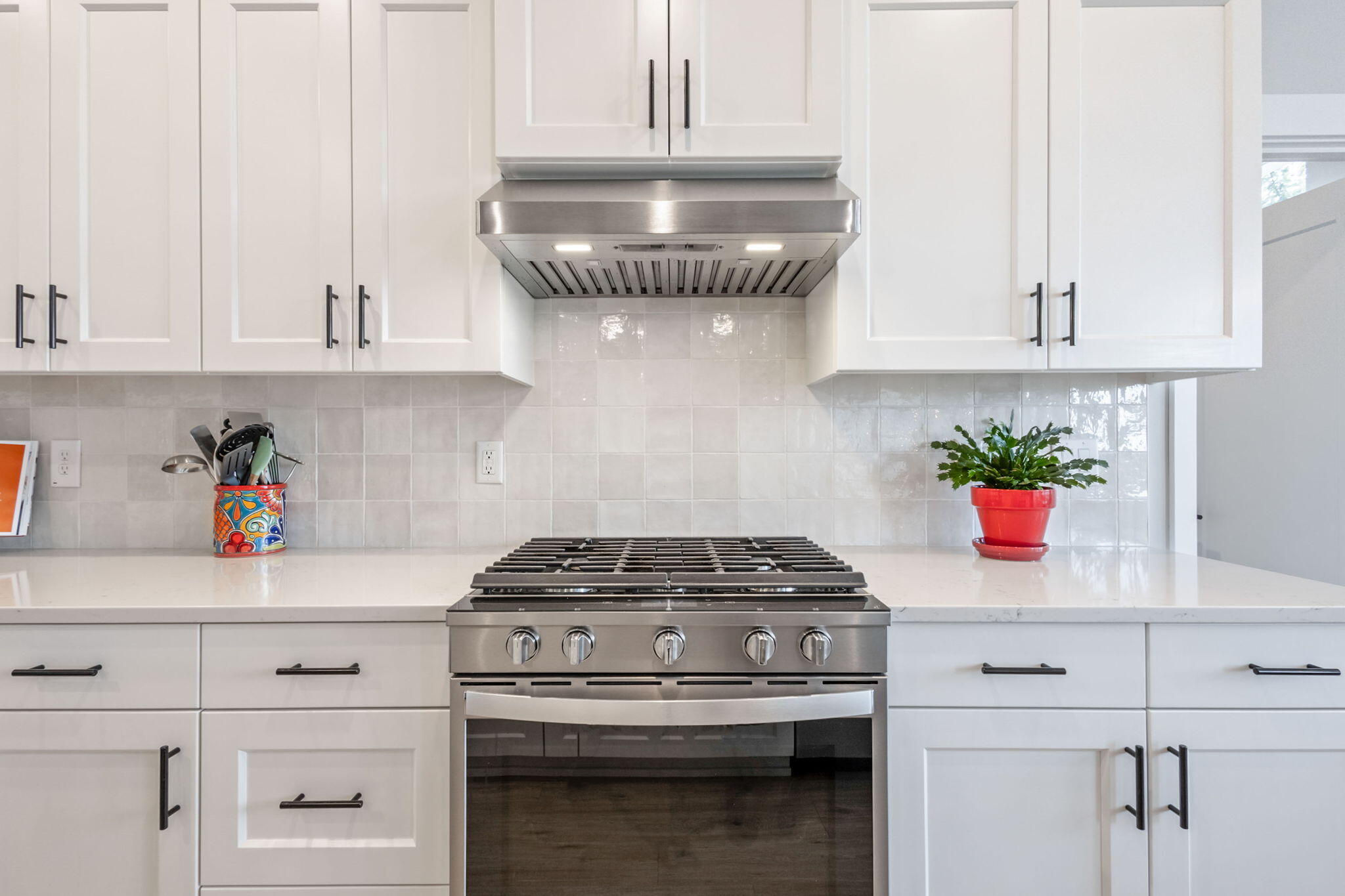 3827 Northeast Oakside Loop Bend, OR 97701 - Photo 8 of 50 a kitchen with white cabinets and white appliances