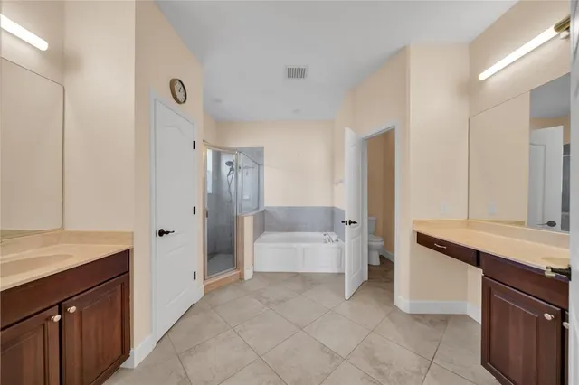 a view of a room with wooden floor and brick wall