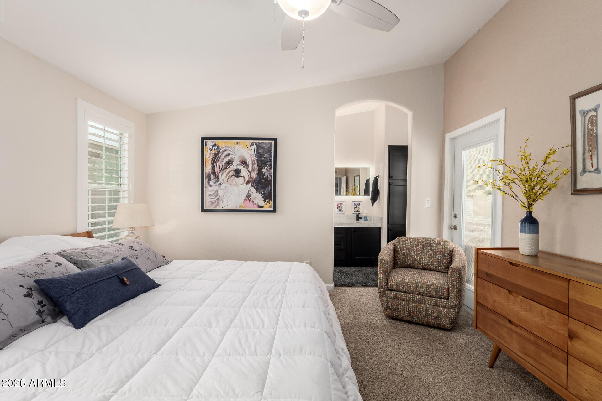 3301 South Goldfield Road, Unit 2004 Apache Junction, AZ 85119 - Photo 8 of 40 a bedroom with a large bed and a couch