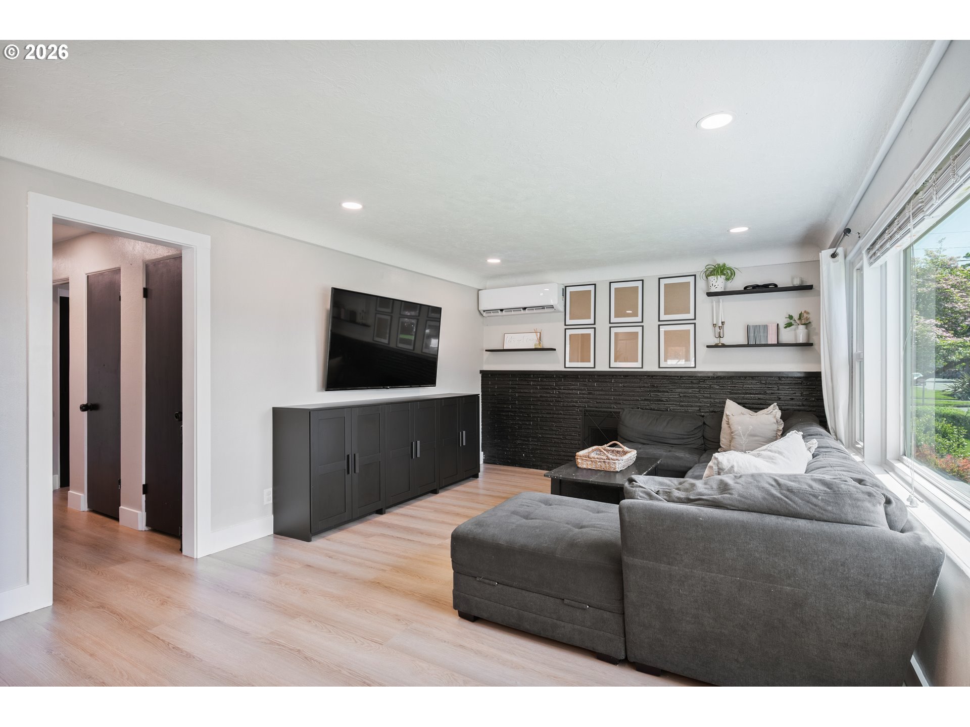 2808 Lilac Street Longview, WA 98632 - Photo 5 of 29 a living room with furniture and a flat screen tv