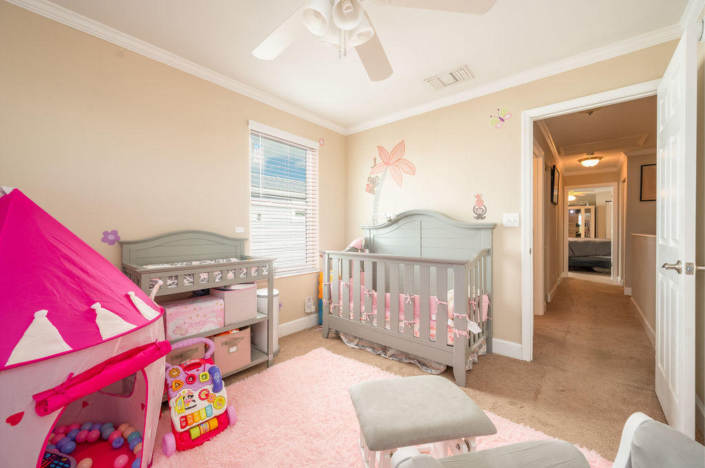 5030 5th Avenue, Unit 2 Key West, FL 33040 - Photo 12 of 16 a bedroom with furniture and a baby crib