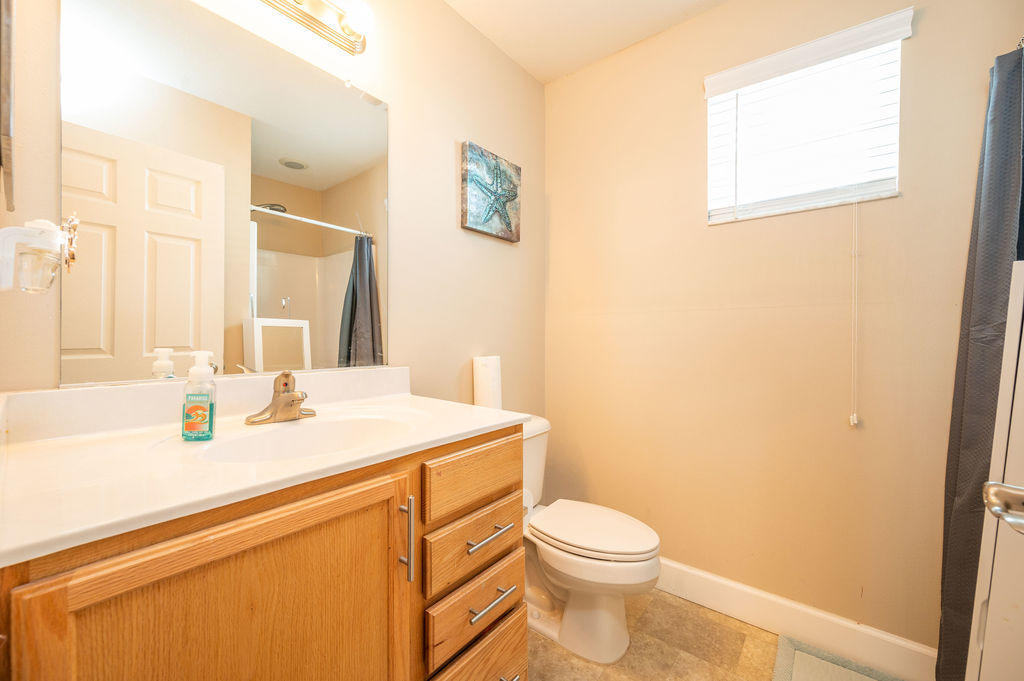 5030 5th Avenue, Unit 2 Key West, FL 33040 - Photo 13 of 16 a bathroom with a sink and a toilet