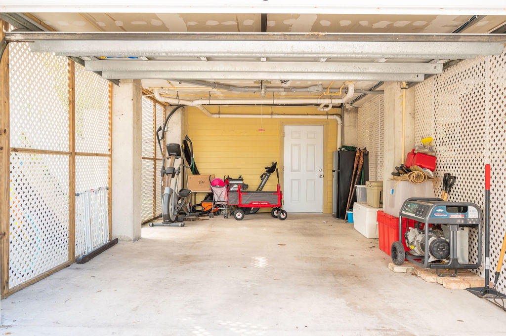 5030 5th Avenue, Unit 2 Key West, FL 33040 - Photo 14 of 16 a view of a garage with rack and bicycle