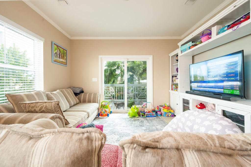 5030 5th Avenue, Unit 2 Key West, FL 33040 - Photo 5 of 16 a living room with furniture and a flat screen tv