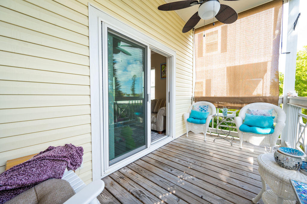 5030 5th Avenue, Unit 2 Key West, FL 33040 - Photo 6 of 16 a balcony with furniture and a potted plant