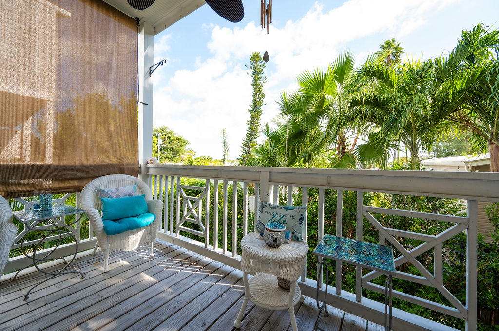 5030 5th Avenue, Unit 2 Key West, FL 33040 - Photo 7 of 16 a view of a balcony with chair