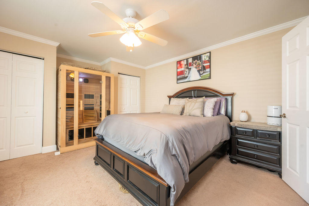 5030 5th Avenue, Unit 2 Key West, FL 33040 - Photo 9 of 16 a spacious bedroom with a bed and a large window