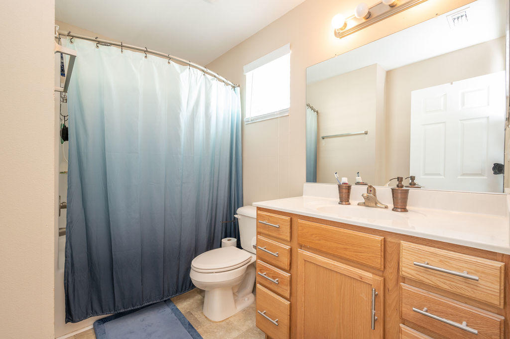 5030 5th Avenue, Unit 2 Key West, FL 33040 - Photo 10 of 16 a bathroom with a sink a toilet and shower