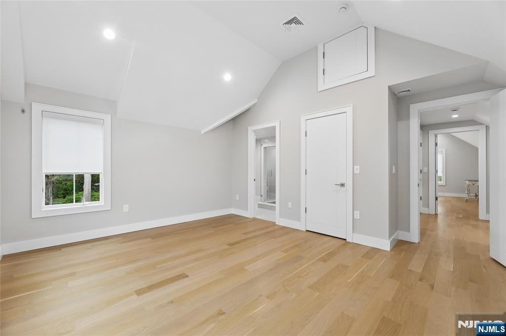 31 Engleside Street Cresskill, NJ 07626 - Photo 33 of 49 a view of an empty room with wooden floor and a window