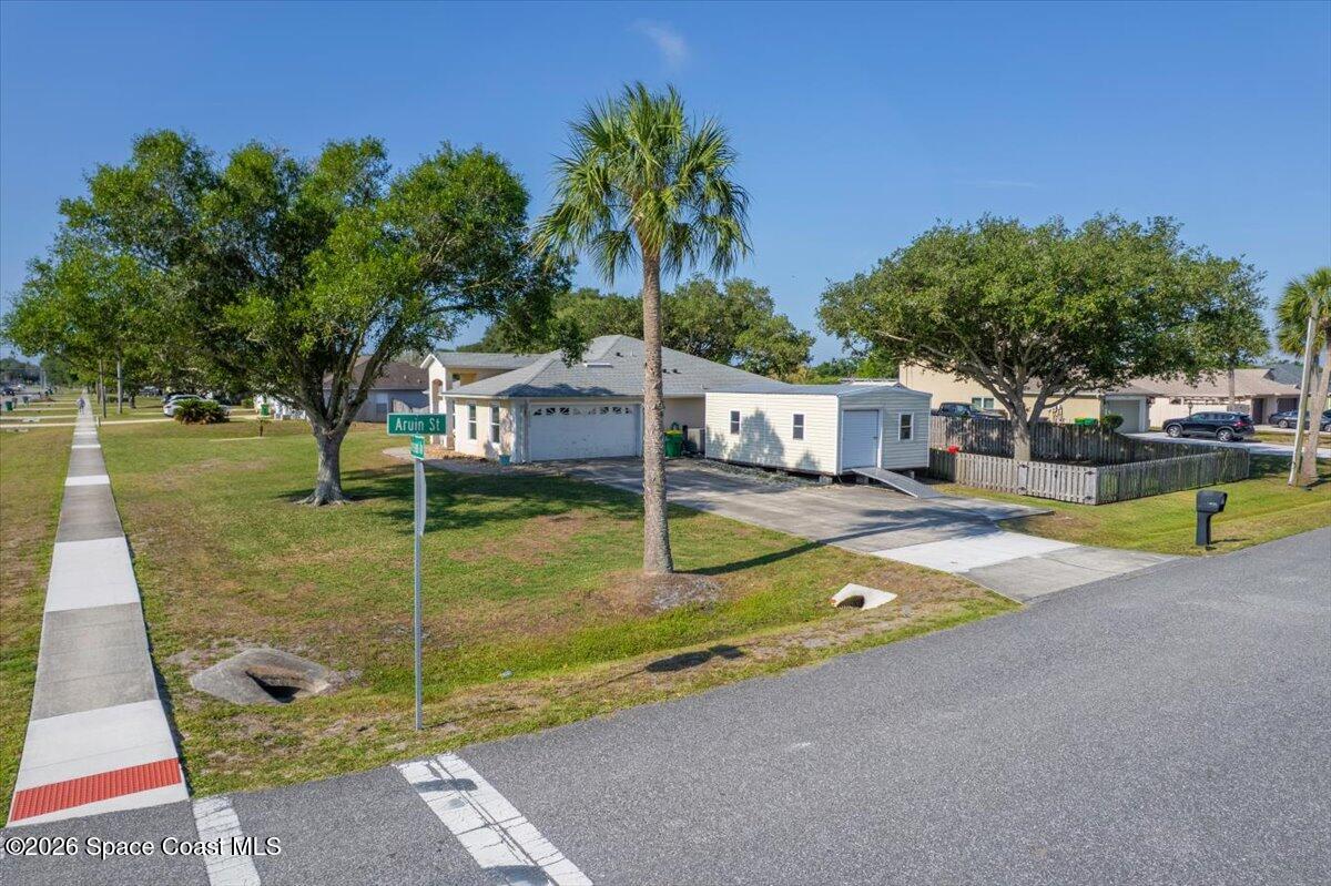 5975 Aruin Street Cocoa, FL 32927 - Photo 43 of 70 a view of a backyard with swimming pool