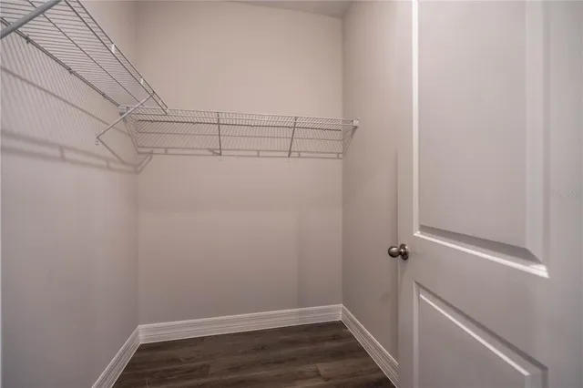 a view of empty room with ceiling fan