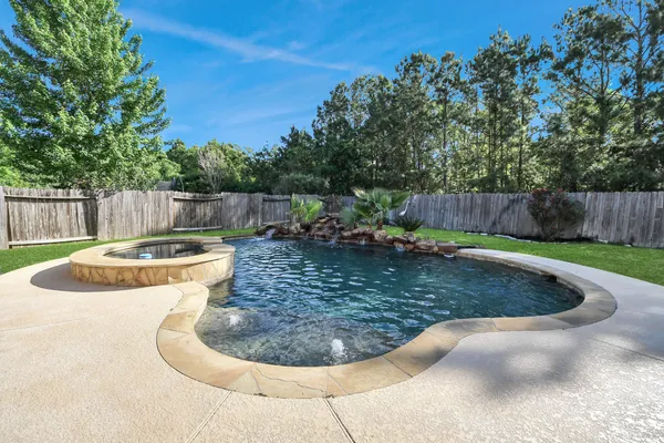 a view of a swimming pool in back