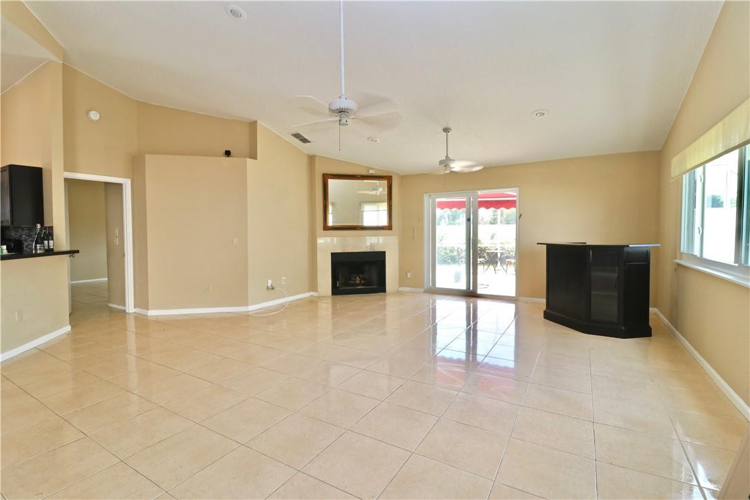 23237 Bentley Place Boca Raton, FL 33433 - Photo 3 of 16 a view of an empty room with a window and fireplace