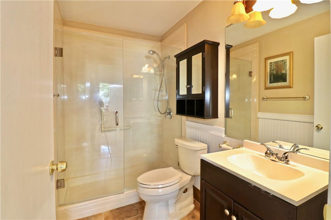 23237 Bentley Place Boca Raton, FL 33433 - Photo 6 of 16 a bathroom with a sink toilet and shower