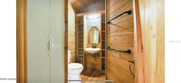 a bathroom with a toilet and shower