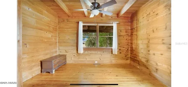 a bathroom with a bathtub and window