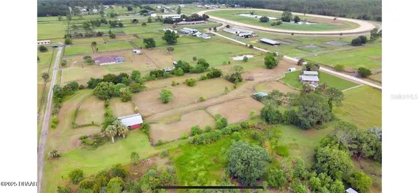a view of a swimming pool with a yard