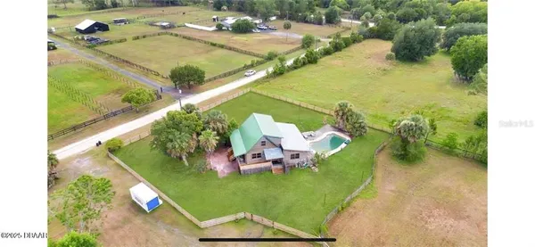 a view of a swimming pool with a yard