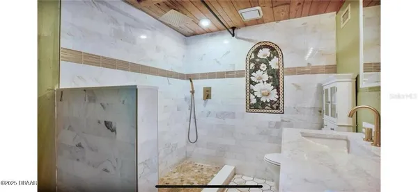 a view of bathroom with a shower