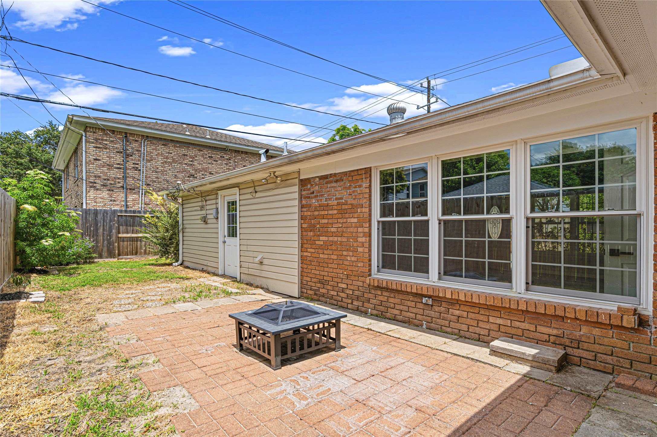 4002 Merrick Street Houston, TX 77025 - Photo 22 of 22 a front view of a house with a yard