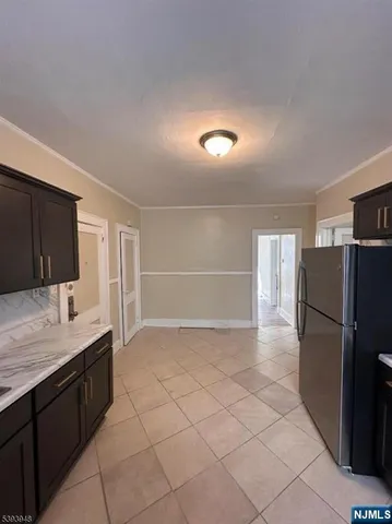 a kitchen with a refrigerator and a sink