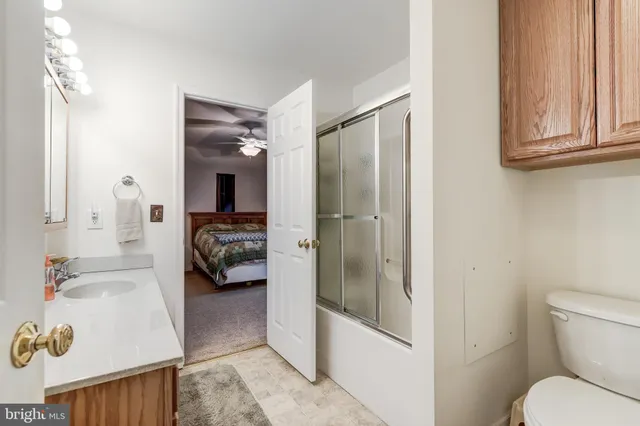 a en suite bathroom with a sink a toilet and shower