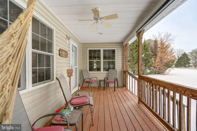 a view of a two chairs in the balcony