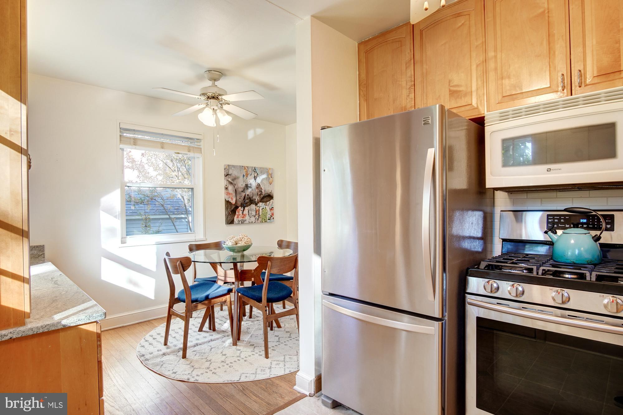 10418 Hemley Lane Silver Spring, MD 20902 - Photo 6 of 32 Light filled kitchen opens to dining space & deck