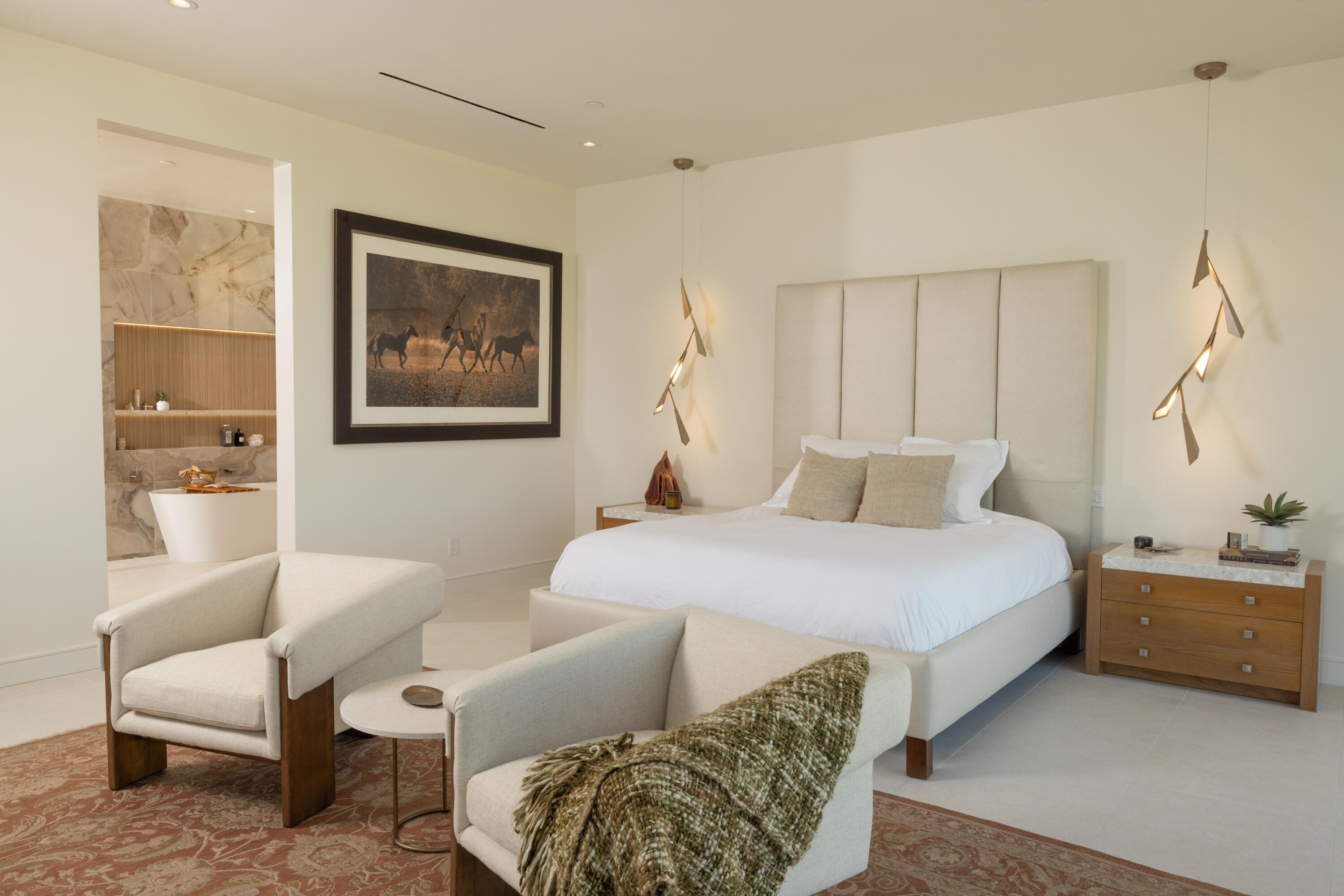 96 Royal St Georges Way Rancho Mirage, CA 92270 - Photo 11 of 34 a bedroom with a bed and a couch
