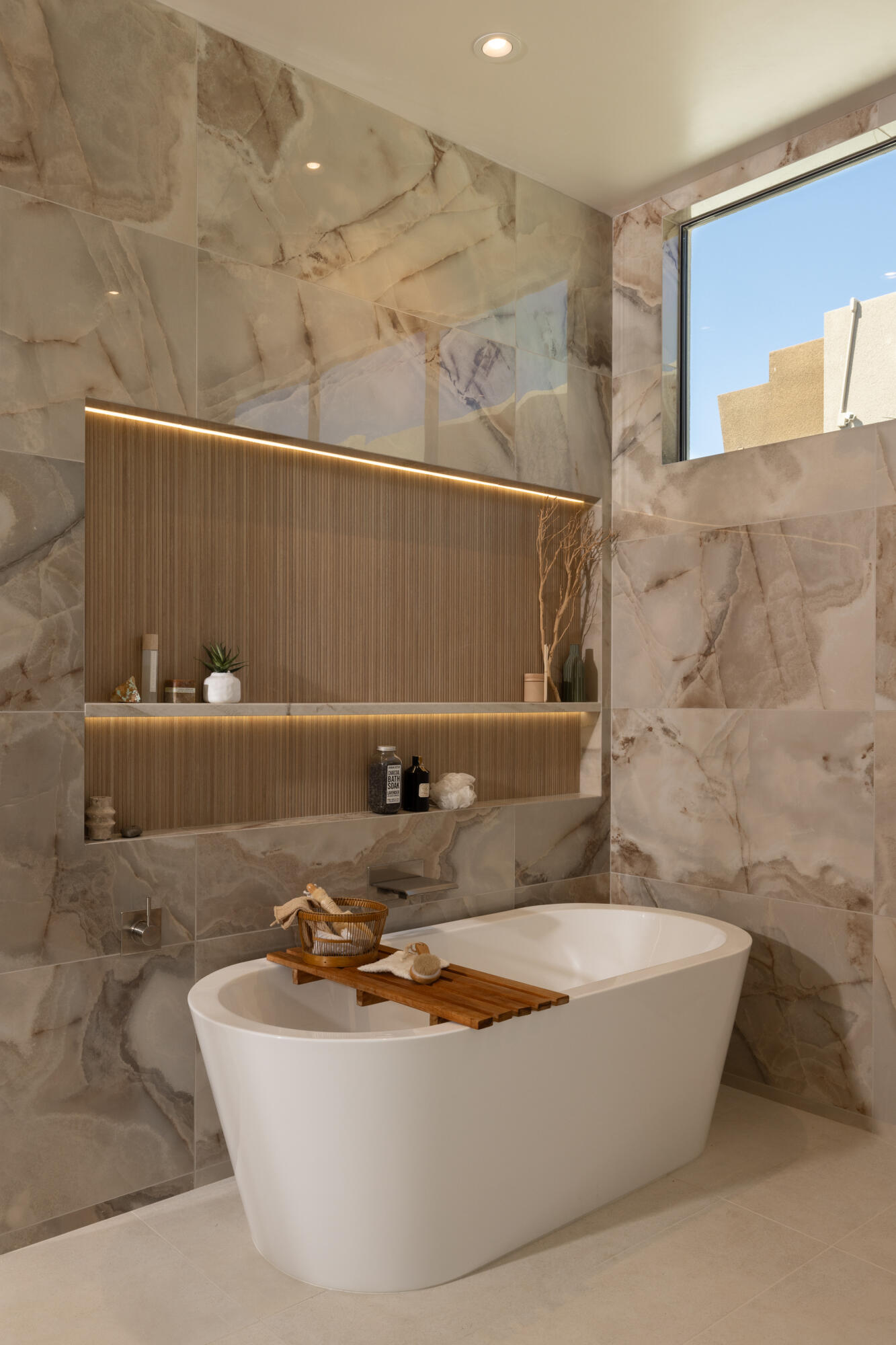 96 Royal St Georges Way Rancho Mirage, CA 92270 - Photo 12 of 34 a bath tub sitting next to a white sink and a shower