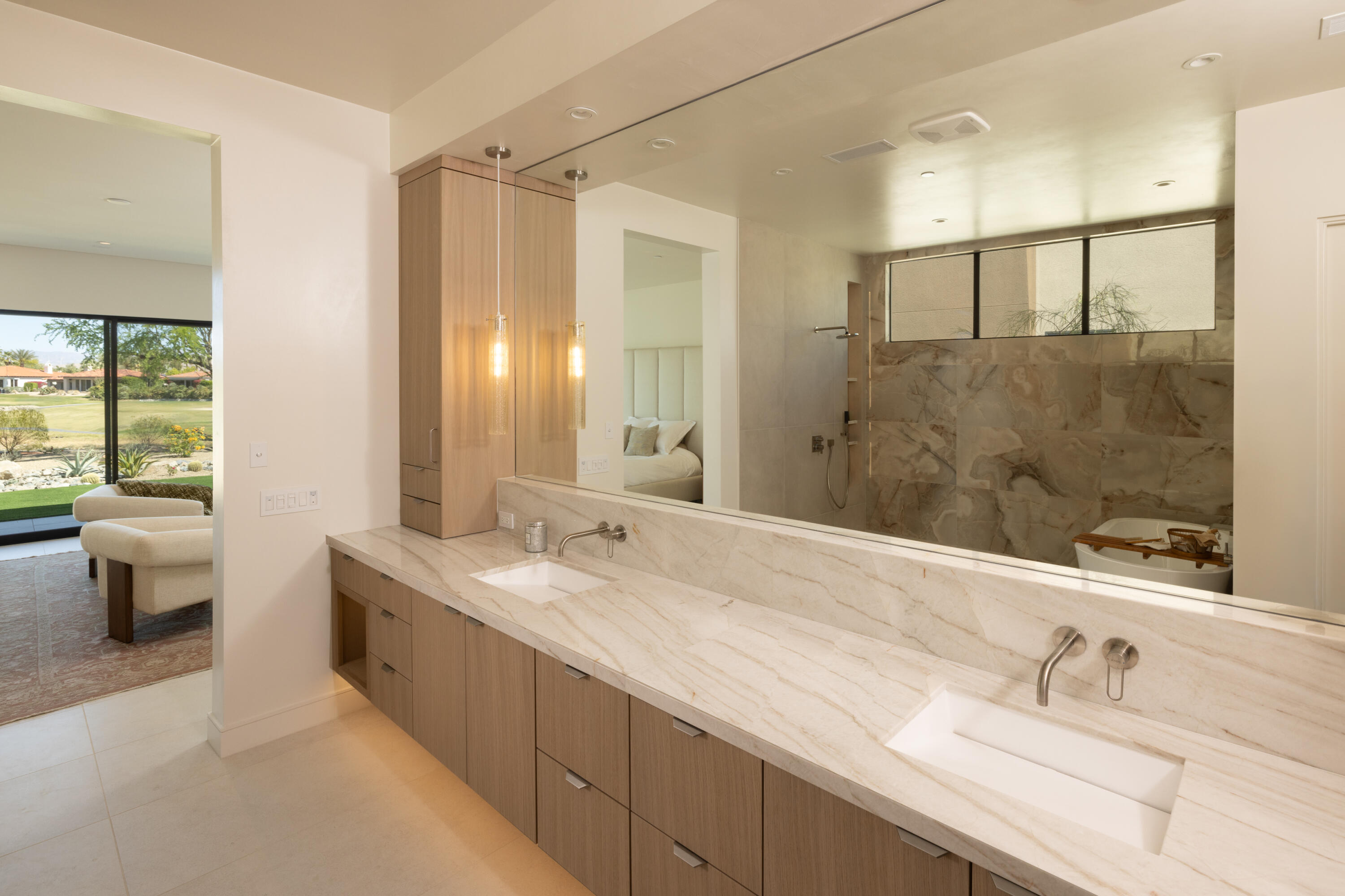 96 Royal St Georges Way Rancho Mirage, CA 92270 - Photo 14 of 34 a bathroom with a double vanity sink toilet and shower