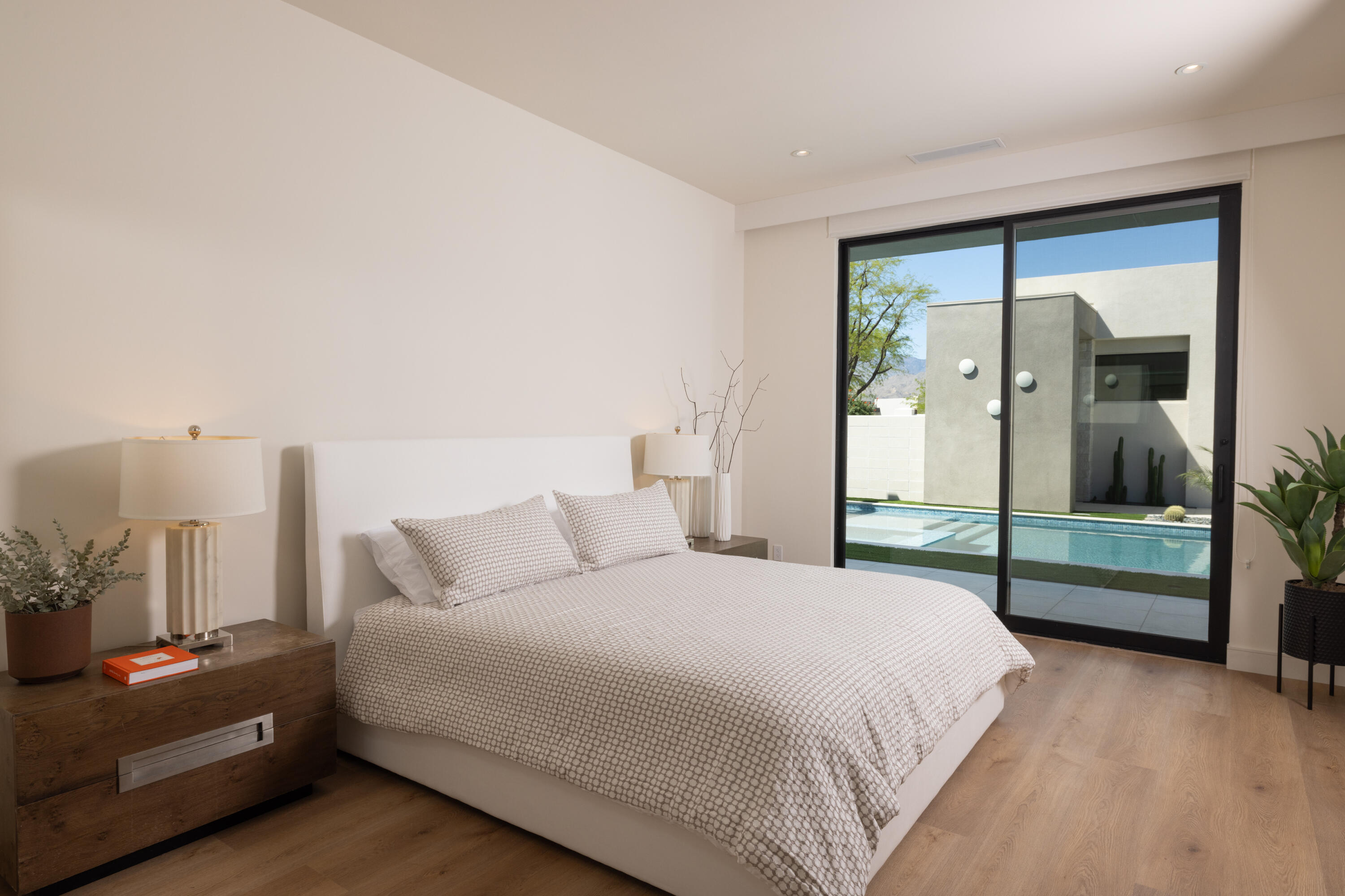 96 Royal St Georges Way Rancho Mirage, CA 92270 - Photo 17 of 34 a bedroom with a bed and a large window