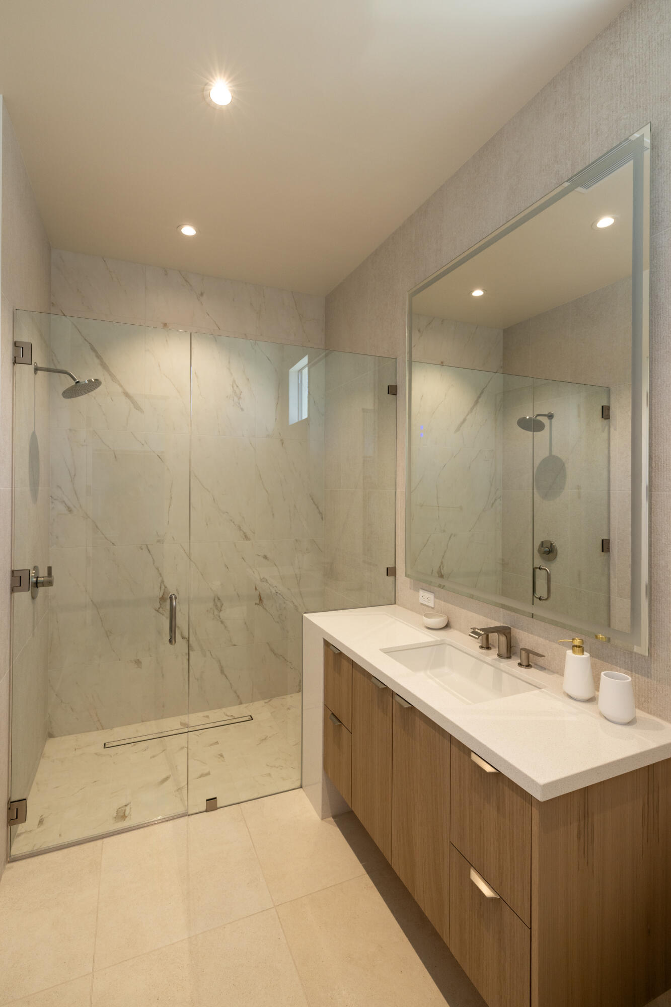 96 Royal St Georges Way Rancho Mirage, CA 92270 - Photo 20 of 34 a bathroom with a sink shower and a mirror
