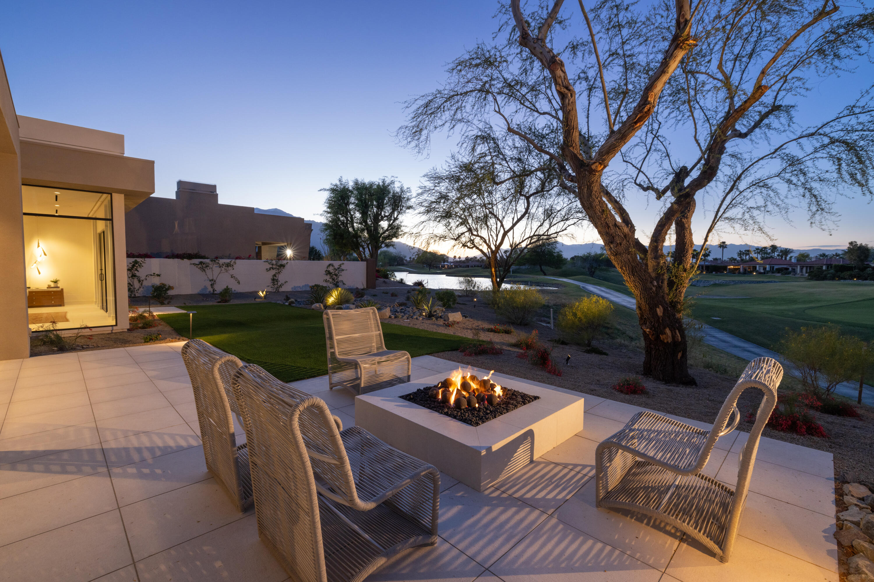 96 Royal St Georges Way Rancho Mirage, CA 92270 - Photo 31 of 34 a backyard of a house with table and chairs