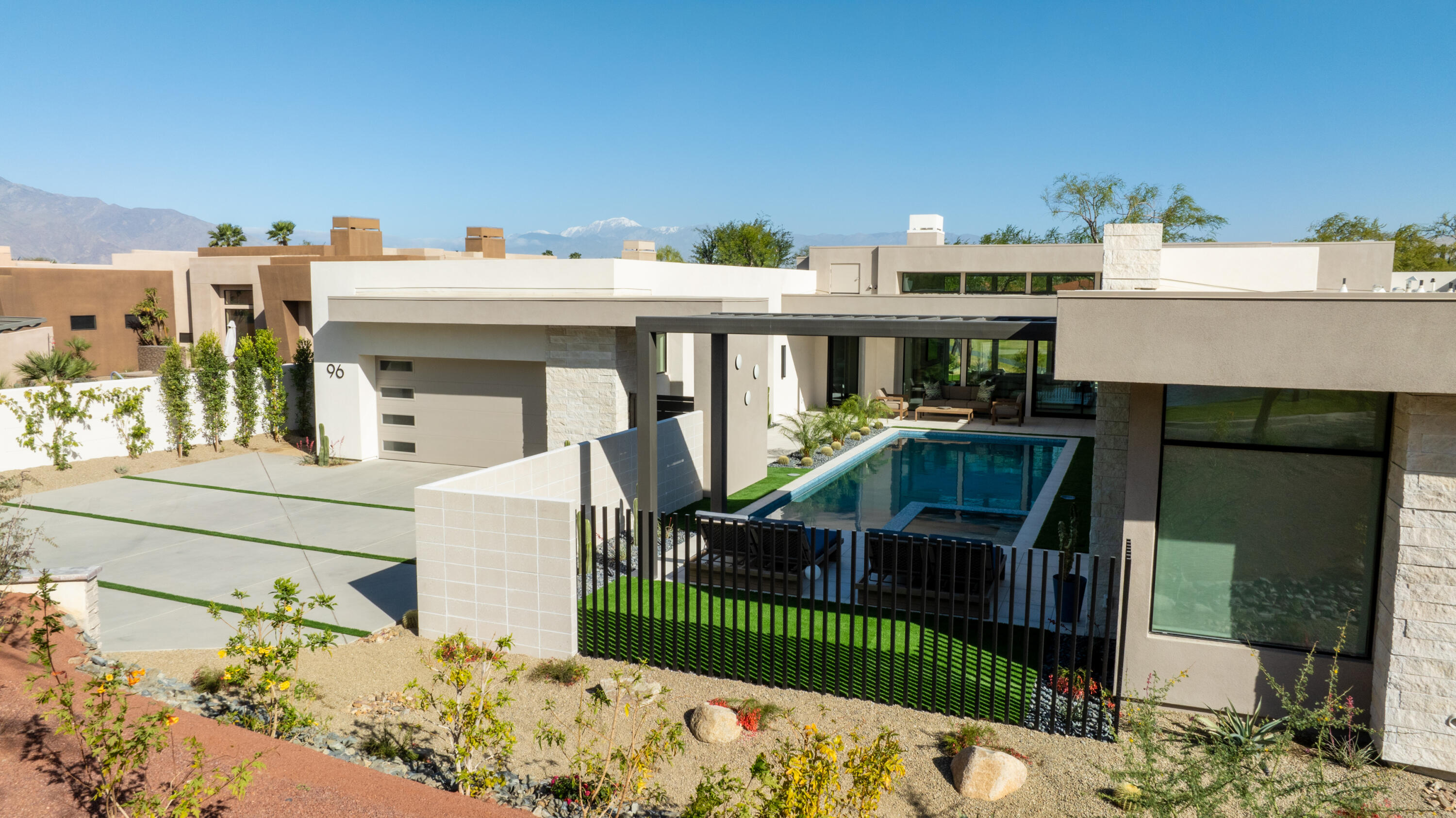96 Royal St Georges Way Rancho Mirage, CA 92270 - Photo 5 of 34 a view of a house with wooden fence