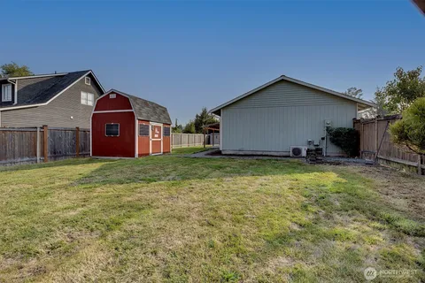 a front view of house with yard and garage