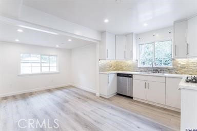 6846 St Estaban Street Tujunga, CA 91042 - Photo 5 of 13 a kitchen with a sink window and cabinets
