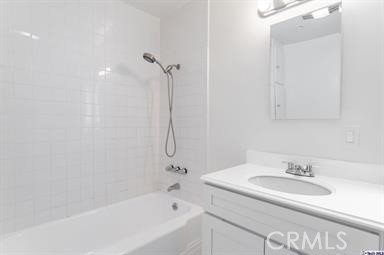 6846 St Estaban Street Tujunga, CA 91042 - Photo 10 of 13 a bathroom with a granite countertop sink a mirror and a bathtub