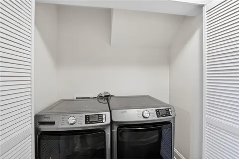 a utility room with washer and dryer