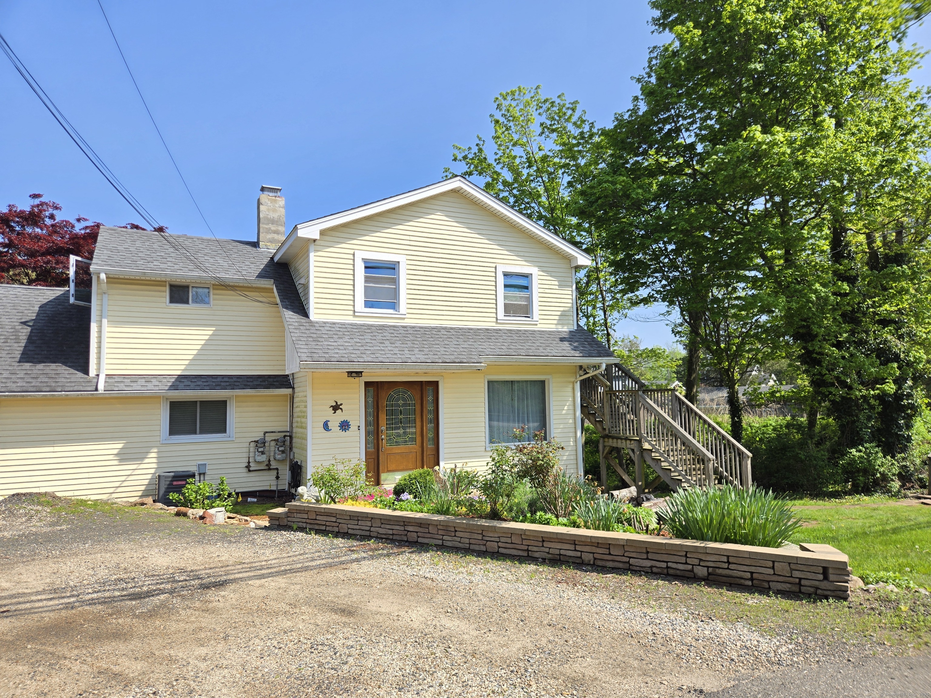 190 Short Beach Road Branford, CT 06405 - Photo 1 of 1 a front view of a house with a yard and garage