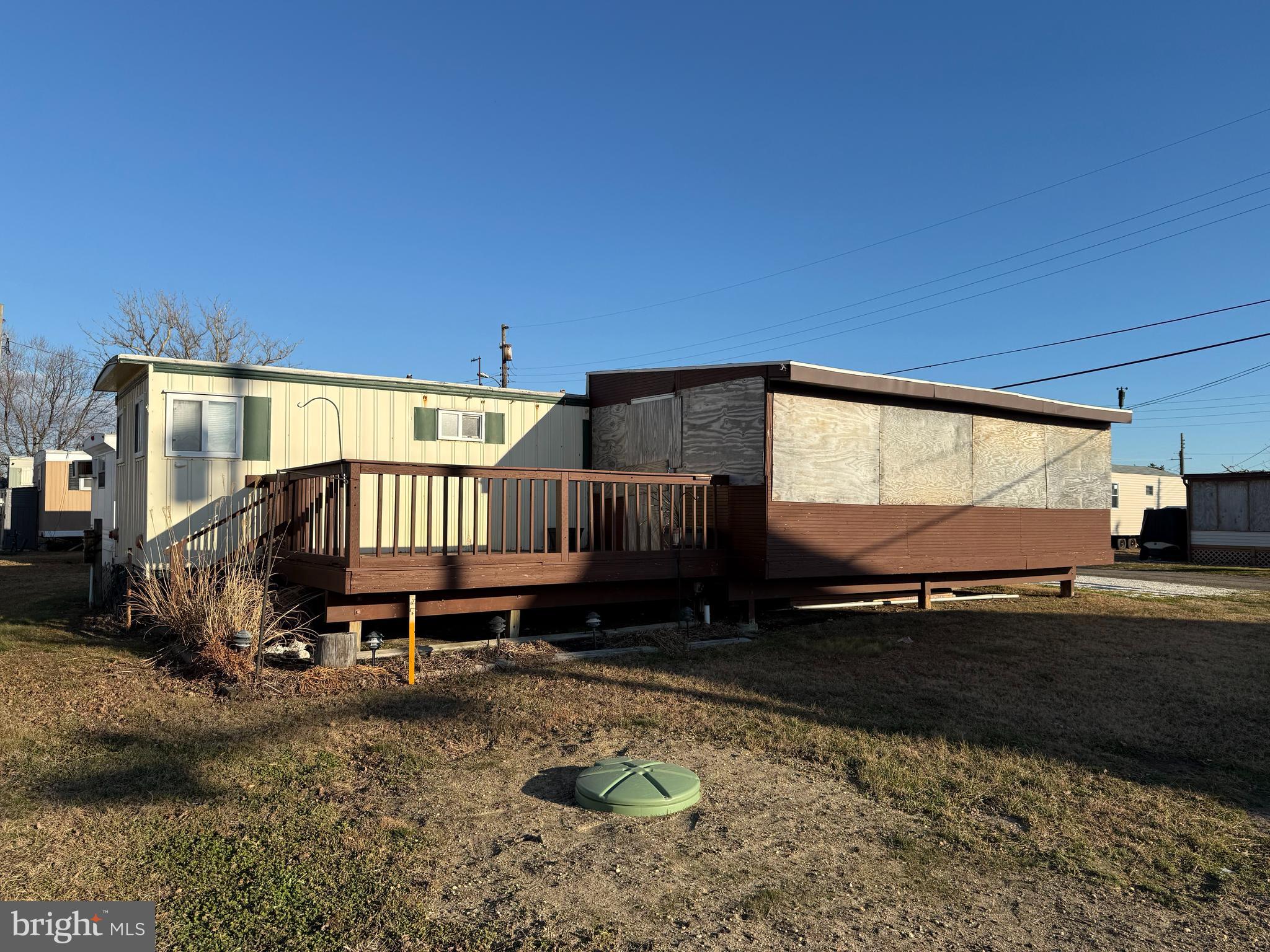 a backyard of a house with barbeque oven table and chairs