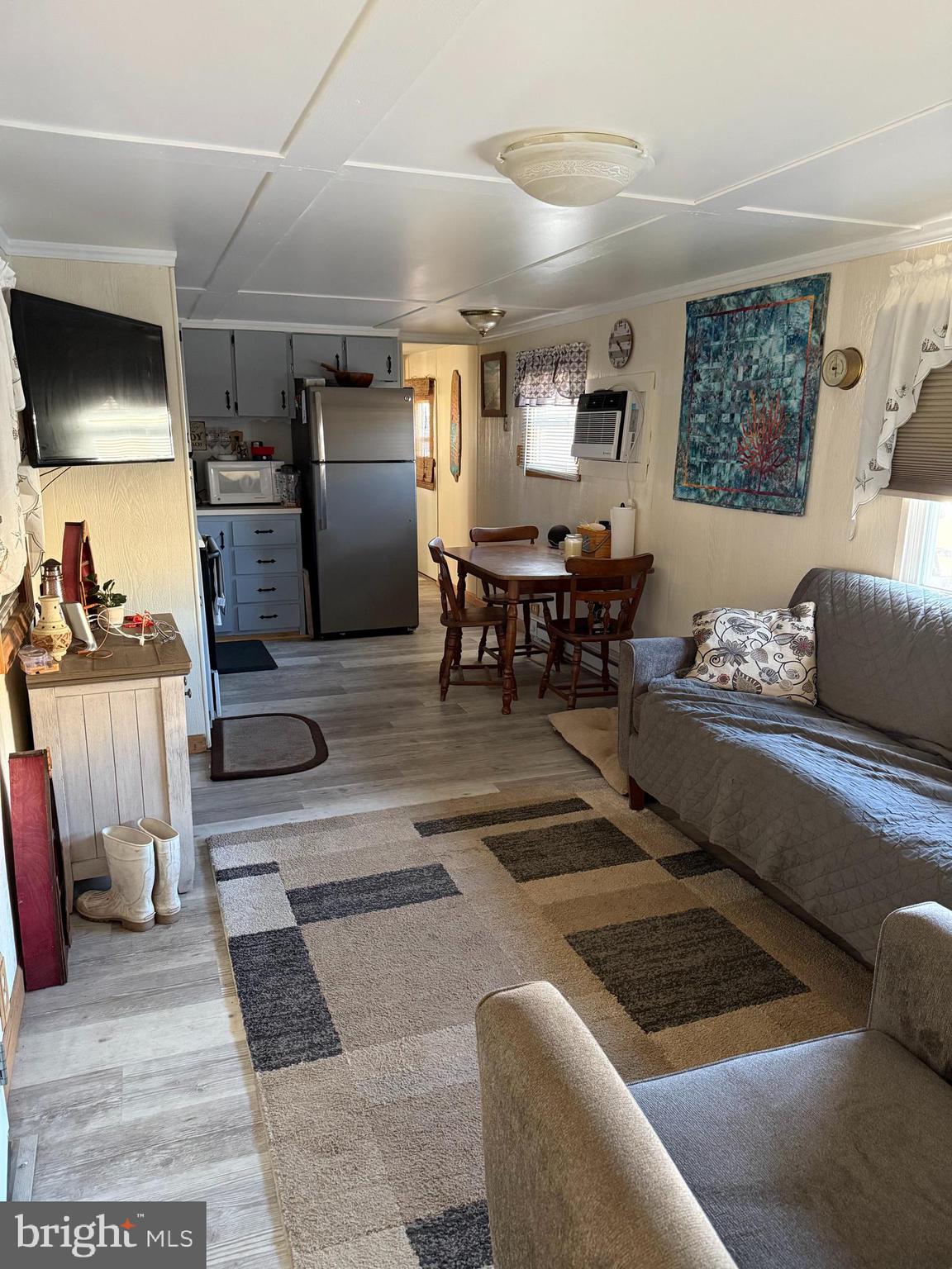 1 Adaline Avenue, Unit A Fortescue, NJ 08321 - Photo 7 of 11 a living room with furniture and a flat screen tv