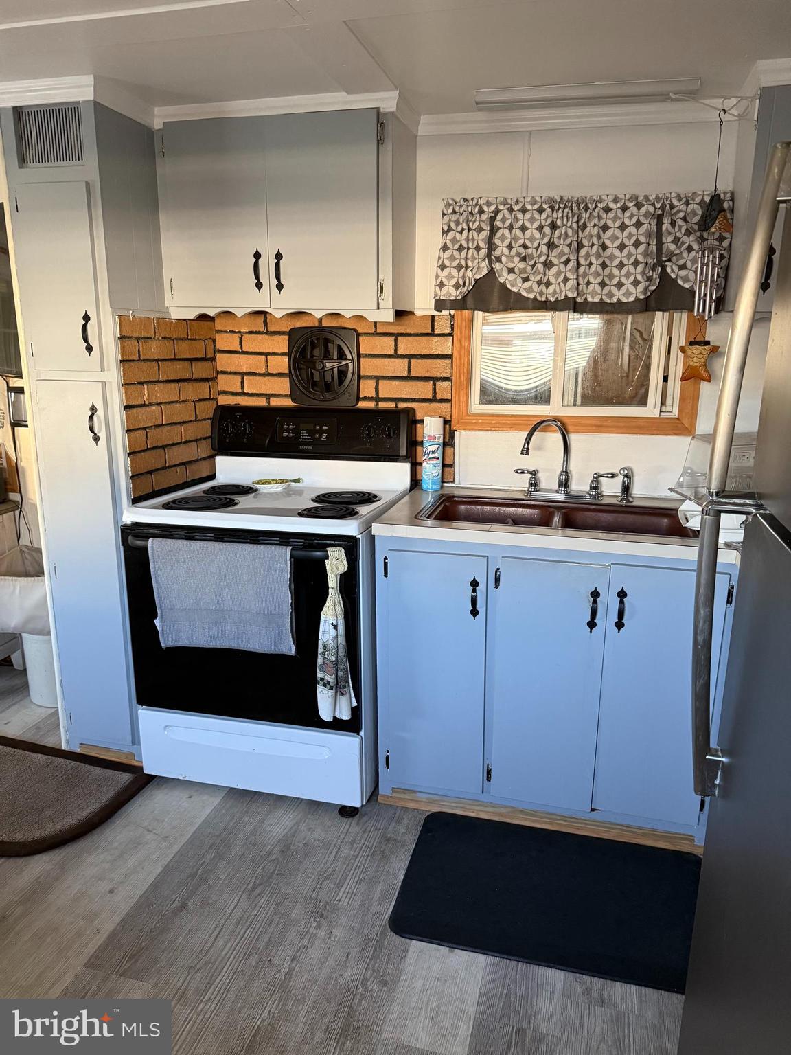 1 Adaline Avenue, Unit A Fortescue, NJ 08321 - Photo 10 of 11 a kitchen with granite countertop a stove and a sink