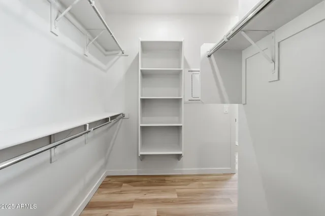 a view of an empty walk in closet